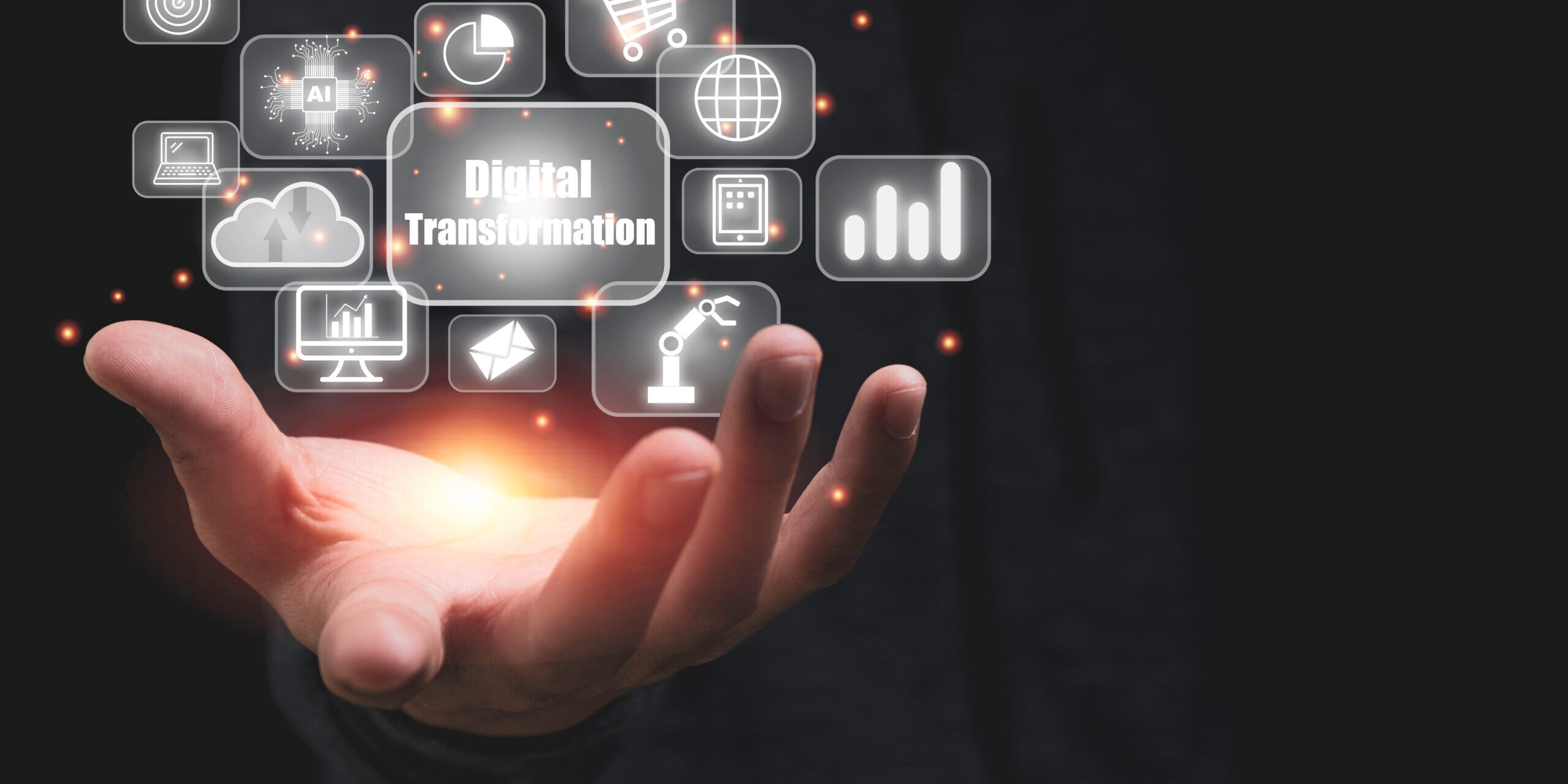 Hand holding digital transformation with technology icons such