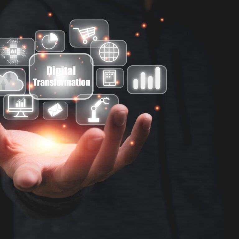 Hand holding digital transformation with technology icons such